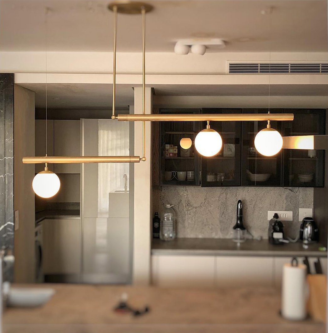 modern-geometric-satellite-pendant-light-with-opal-glass-globes-and-adjustable-brass-arms