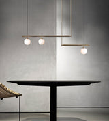 modern-geometric-satellite-pendant-light-with-opal-glass-globes-and-adjustable-brass-arms