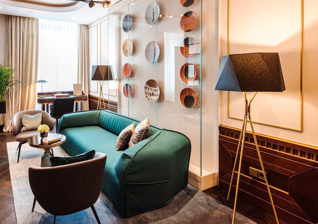modern-solitaire-tripod-floor-lamp-with-black-polygonal-cloth-shade-and-brass-accents