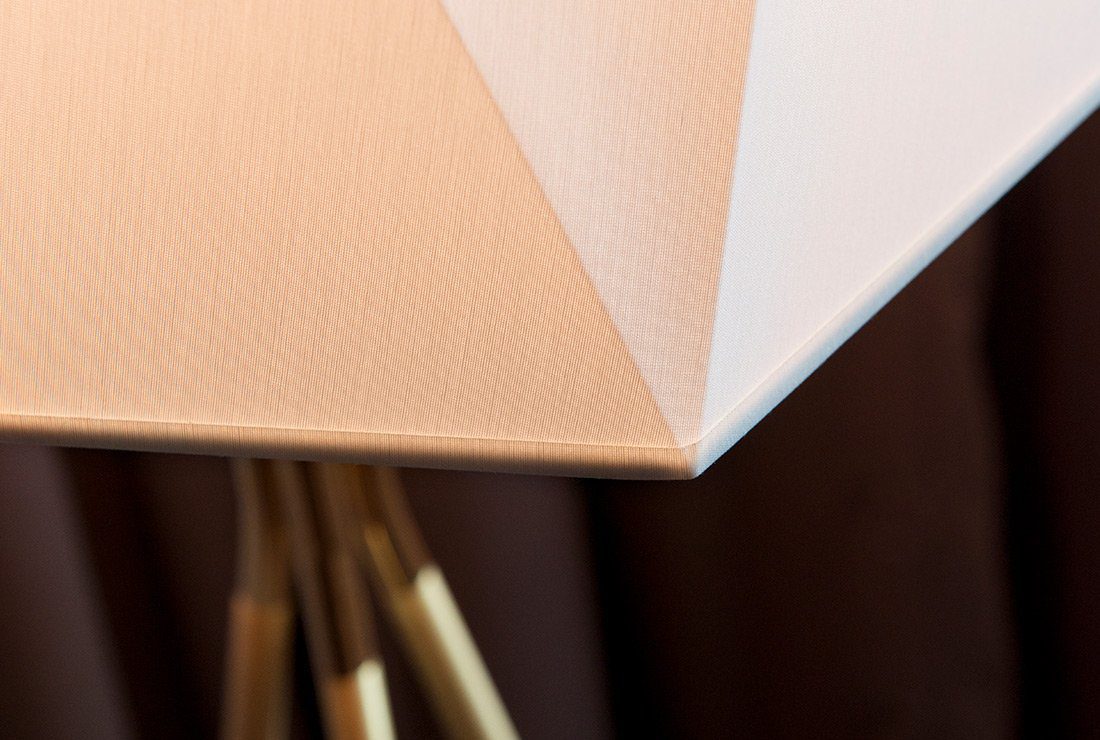 modern-solitaire-tripod-floor-lamp-with-black-polygonal-cloth-shade-and-brass-accents