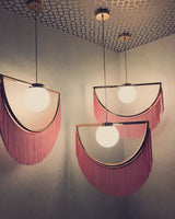 modern-bohemian-tassel-fringe-pendant-light-with-glass-globe-and-gold-metal-frame