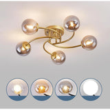Modern Swirled Metal Flush Mount Light with Elegant Glass Globes for Ambient Bedroom Lighting