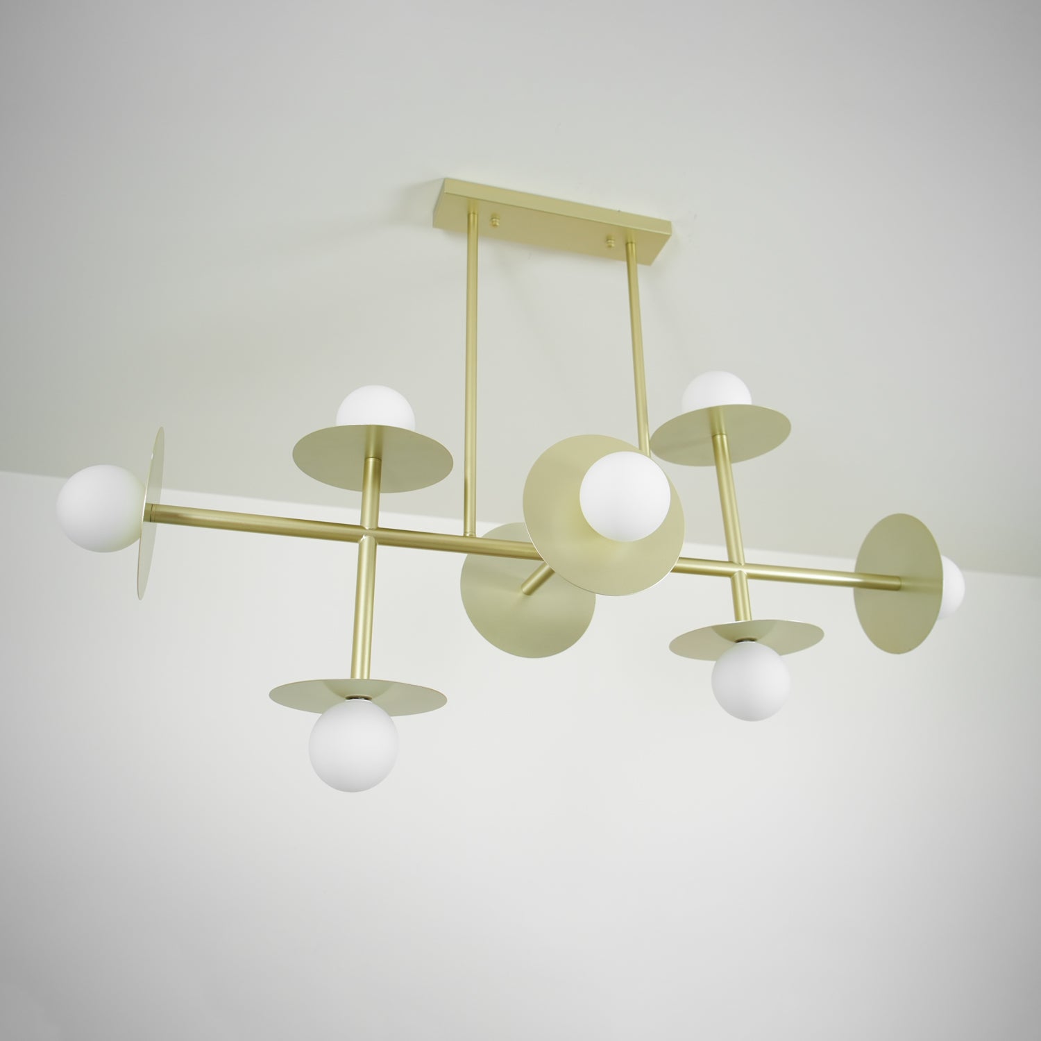 Strada Modern Starburst Chandelier with White Glass Globes and Metal Frame