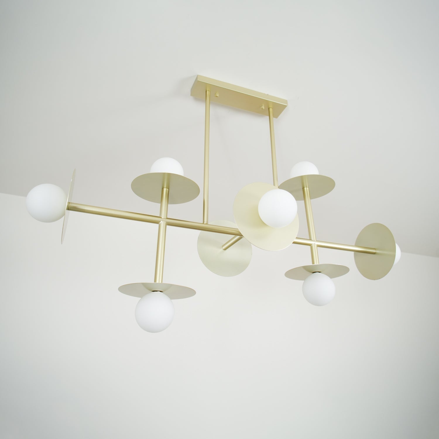 Strada Modern Starburst Chandelier with White Glass Globes and Metal Frame