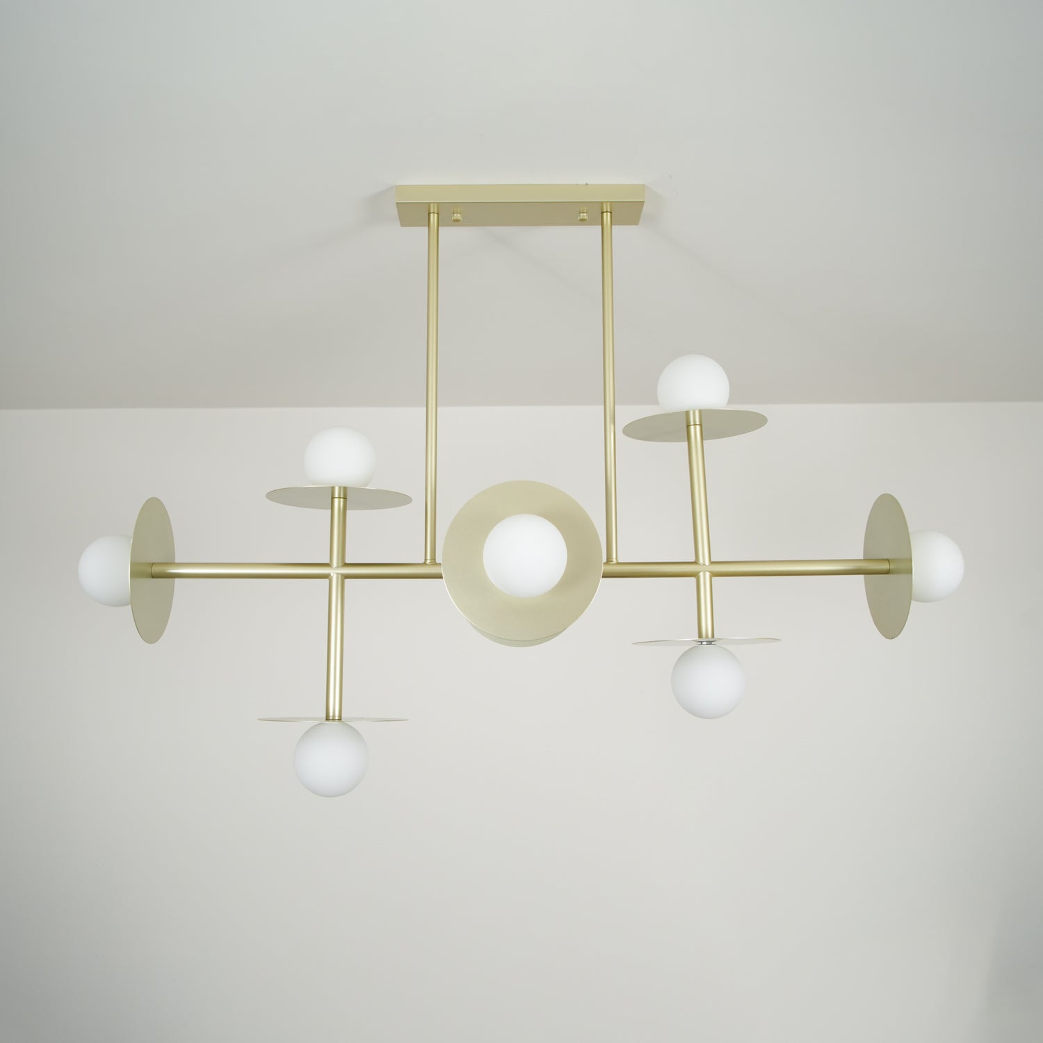 Strada Modern Starburst Chandelier with White Glass Globes and Metal Frame