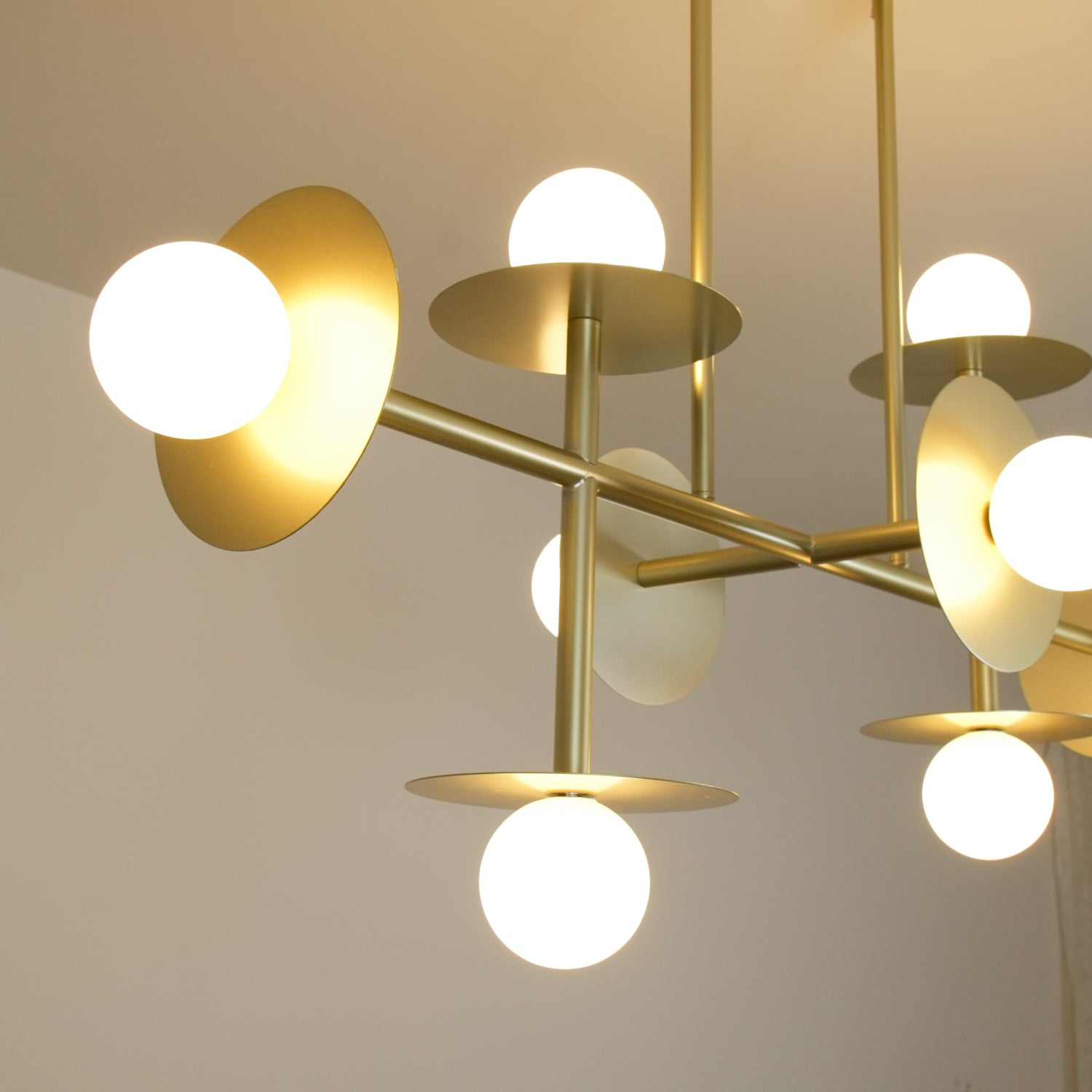 Strada Modern Starburst Chandelier with White Glass Globes and Metal Frame