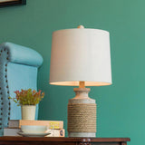 Vintage Coastal Style Stone Table Lamp with Rope Accents and Tapered Oatmeal Fabric Drum Shade