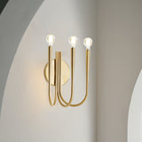 Vintage Curved Swoop Arm Wall Sconce with Clear Glass Globe Shade and Metal Finish
