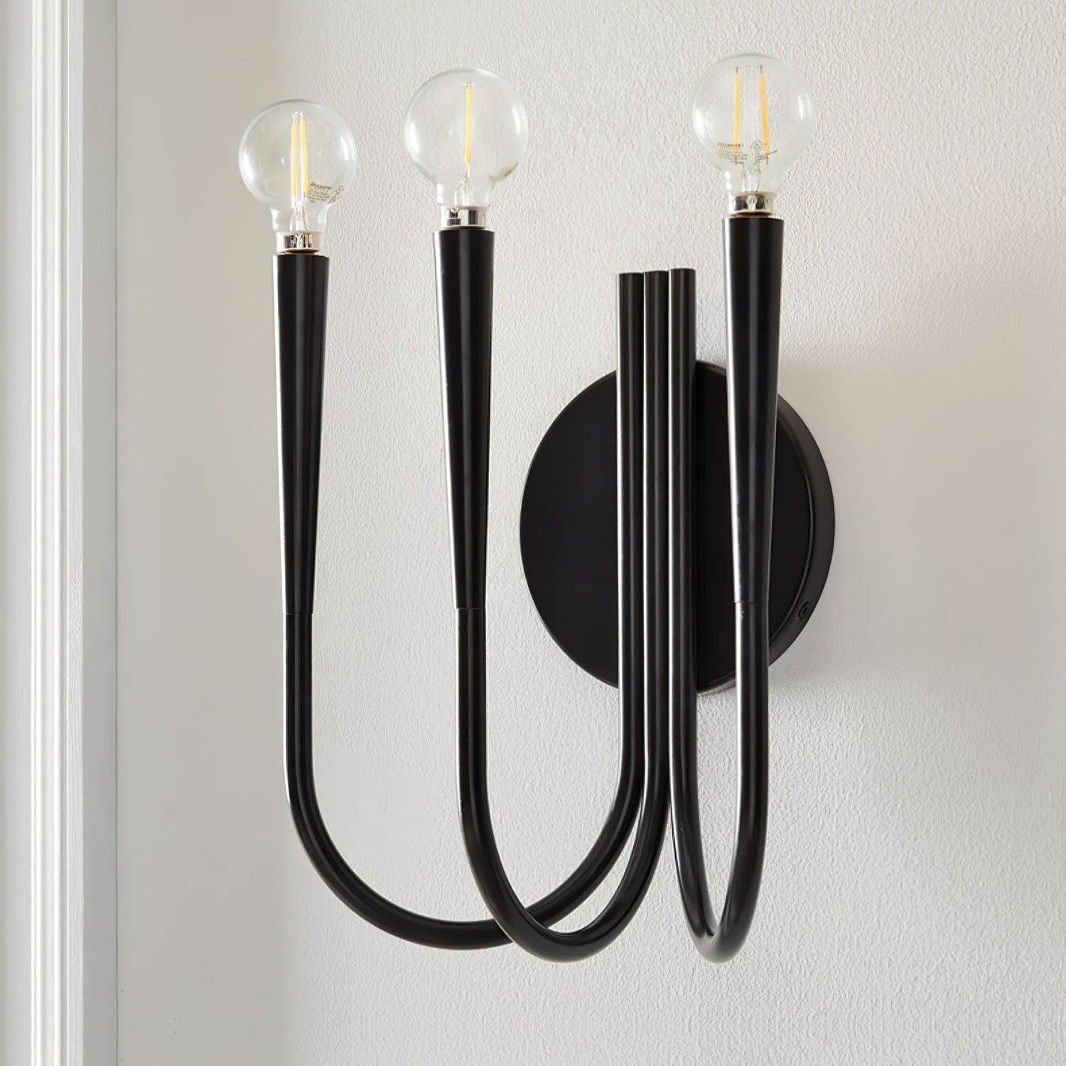 Vintage Curved Swoop Arm Wall Sconce with Clear Glass Globe Shade and Metal Finish