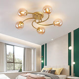 Modern Swirled Metal Flush Mount Light with Elegant Glass Globes for Ambient Bedroom Lighting