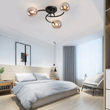 Modern Swirled Metal Flush Mount Light with Elegant Glass Globes for Ambient Bedroom Lighting