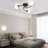 Modern Swirled Metal Flush Mount Light with Elegant Glass Globes for Ambient Bedroom Lighting