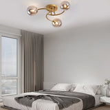 Modern Swirled Metal Flush Mount Light with Elegant Glass Globes for Ambient Bedroom Lighting