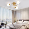 Modern Swirled Metal Flush Mount Light with Elegant Glass Globes for Ambient Bedroom Lighting