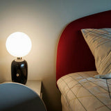 Modern Glass Globe Table Lamp with Polished Metal Frame for Modern Ambient Lighting