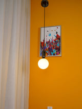 modern-spherical-glass-pendant-light-with-polished-metal-accents-for-luxury-interiors
