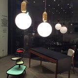 modern-spherical-glass-pendant-light-with-polished-metal-accents-for-luxury-interiors
