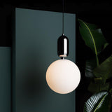 modern-spherical-glass-pendant-light-with-polished-metal-accents-for-luxury-interiors