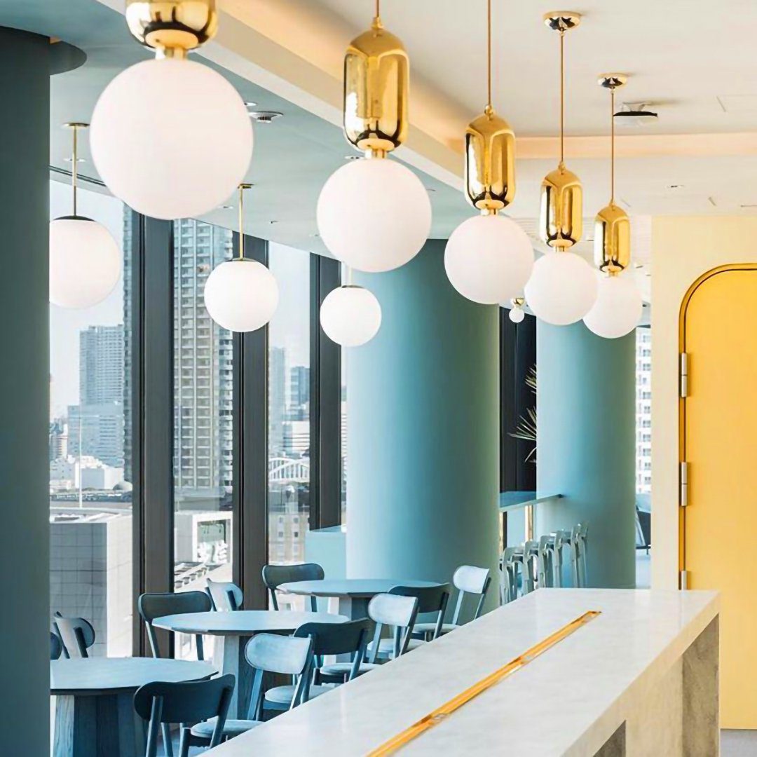 modern-spherical-glass-pendant-light-with-polished-metal-accents-for-luxury-interiors