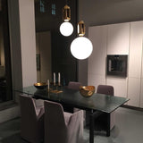 modern-spherical-glass-pendant-light-with-polished-metal-accents-for-luxury-interiors