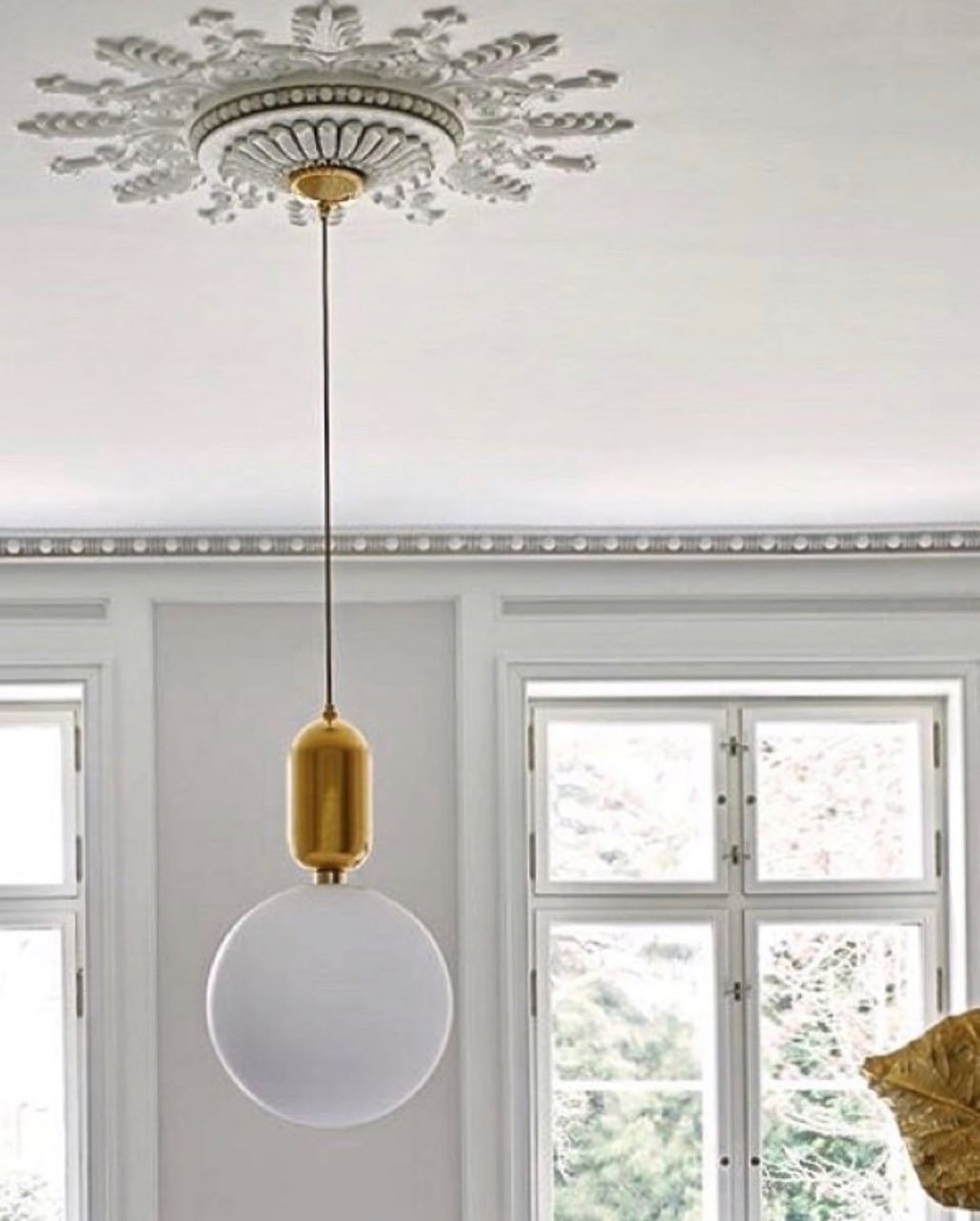 modern-spherical-glass-pendant-light-with-polished-metal-accents-for-luxury-interiors