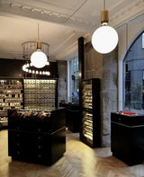 modern-spherical-glass-pendant-light-with-polished-metal-accents-for-luxury-interiors