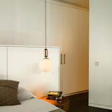 modern-spherical-glass-pendant-light-with-polished-metal-accents-for-luxury-interiors