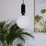modern-spherical-glass-pendant-light-with-polished-metal-accents-for-luxury-interiors