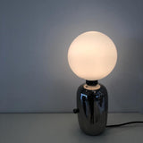 Modern Glass Globe Table Lamp with Polished Metal Frame for Modern Ambient Lighting