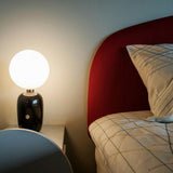 Modern Glass Globe Table Lamp with Polished Metal Frame for Modern Ambient Lighting