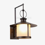 classic-brown-iron-outdoor-wall-lantern-sconce-with-white-glass-shade-for-entryway