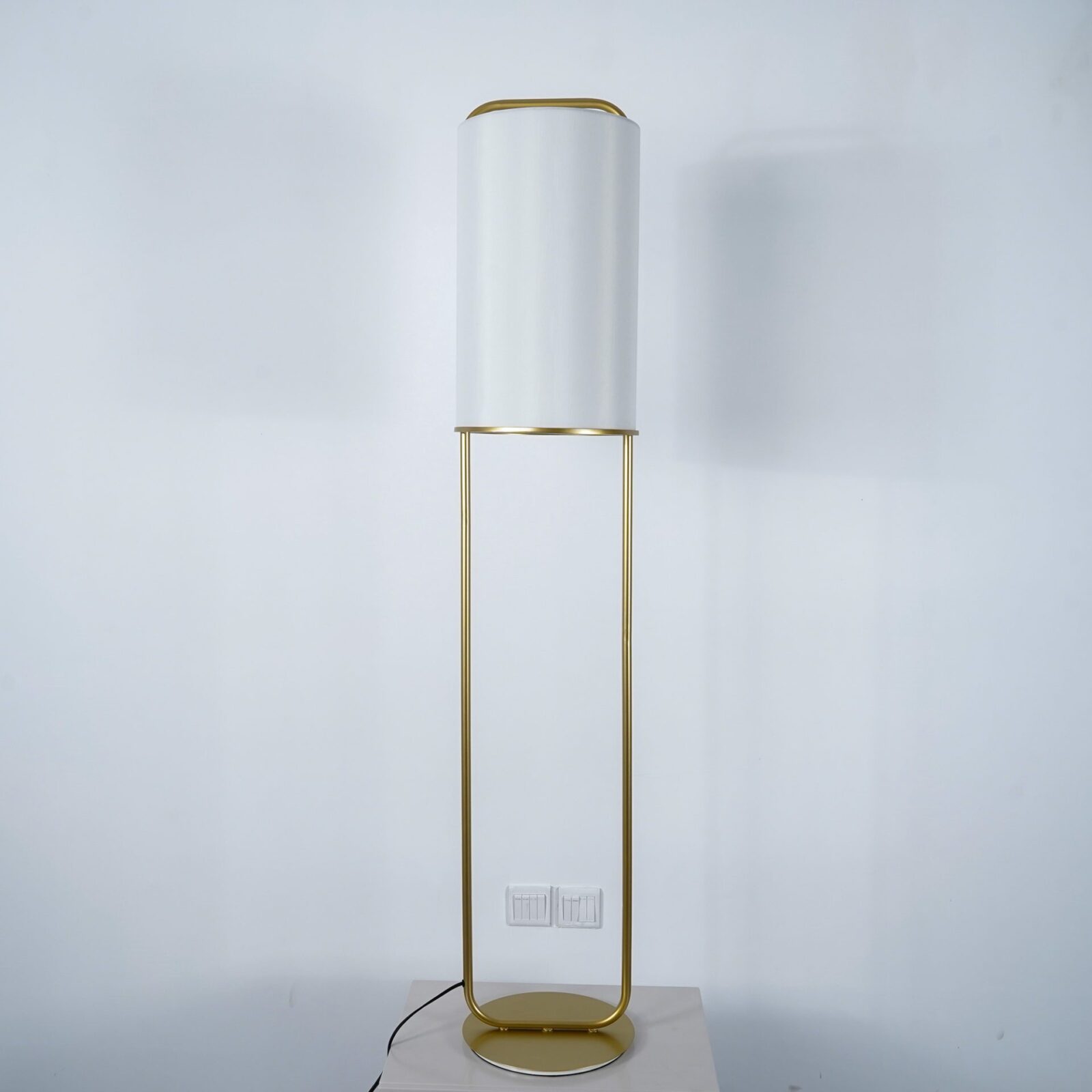 modern-minimalist-geometric-floor-lamp-with-white-fabric-shade-and-gold-metal-base-standing-light