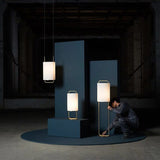 modern-geometric-pendant-light-with-white-fabric-cylindrical-shade-and-gold-metal-finish
