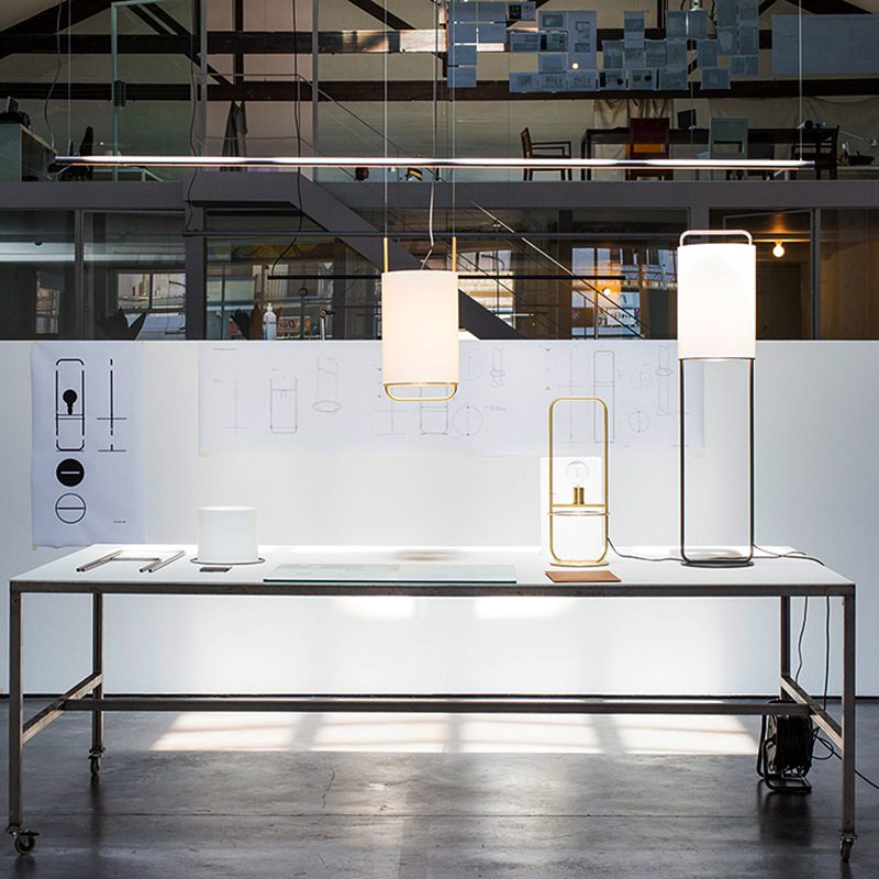 modern-geometric-pendant-light-with-white-fabric-cylindrical-shade-and-gold-metal-finish