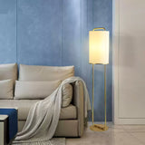 modern-minimalist-geometric-floor-lamp-with-white-fabric-shade-and-gold-metal-base-standing-light