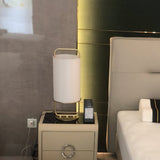 modern-minimalist-geometric-table-lamp-with-white-cloth-shade-and-gold-metal-base-for-elegant-interiors