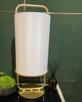 modern-minimalist-geometric-table-lamp-with-white-cloth-shade-and-gold-metal-base-for-elegant-interiors