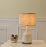 modern-cream-ceramic-table-lamp-with-cotton-fabric-shade-for-bedside-lighting
