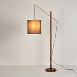 archer-contemporary-arched-wood-standing-lamp-with-adjustable-linen-drum-shade