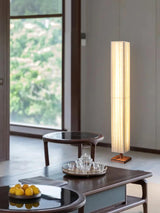 elegant-minimalist-fabric-cylinder-standing-lamp-with-natural-wood-base
