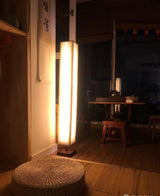 elegant-minimalist-fabric-cylinder-standing-lamp-with-natural-wood-base