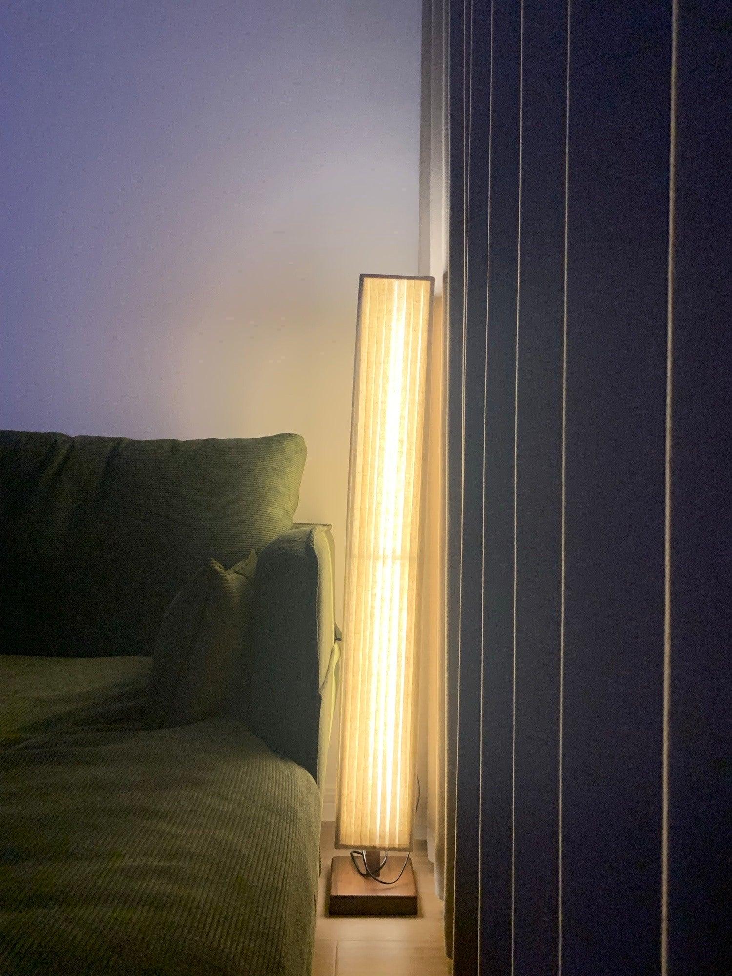 elegant-minimalist-fabric-cylinder-standing-lamp-with-natural-wood-base