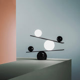 Modern Artistic Balance Table Lamp with Glass Spheres and Black Marble Base