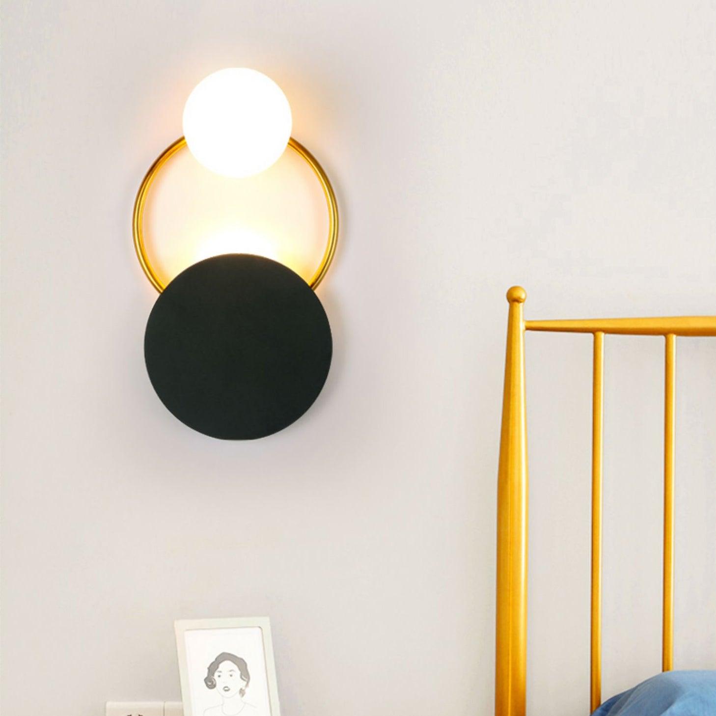 modern-geometric-black-and-gold-wall-sconce-with-white-glass-sphere-light-fixture