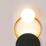 modern-geometric-black-and-gold-wall-sconce-with-white-glass-sphere-light-fixture