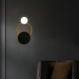 modern-geometric-black-and-gold-wall-sconce-with-white-glass-sphere-light-fixture
