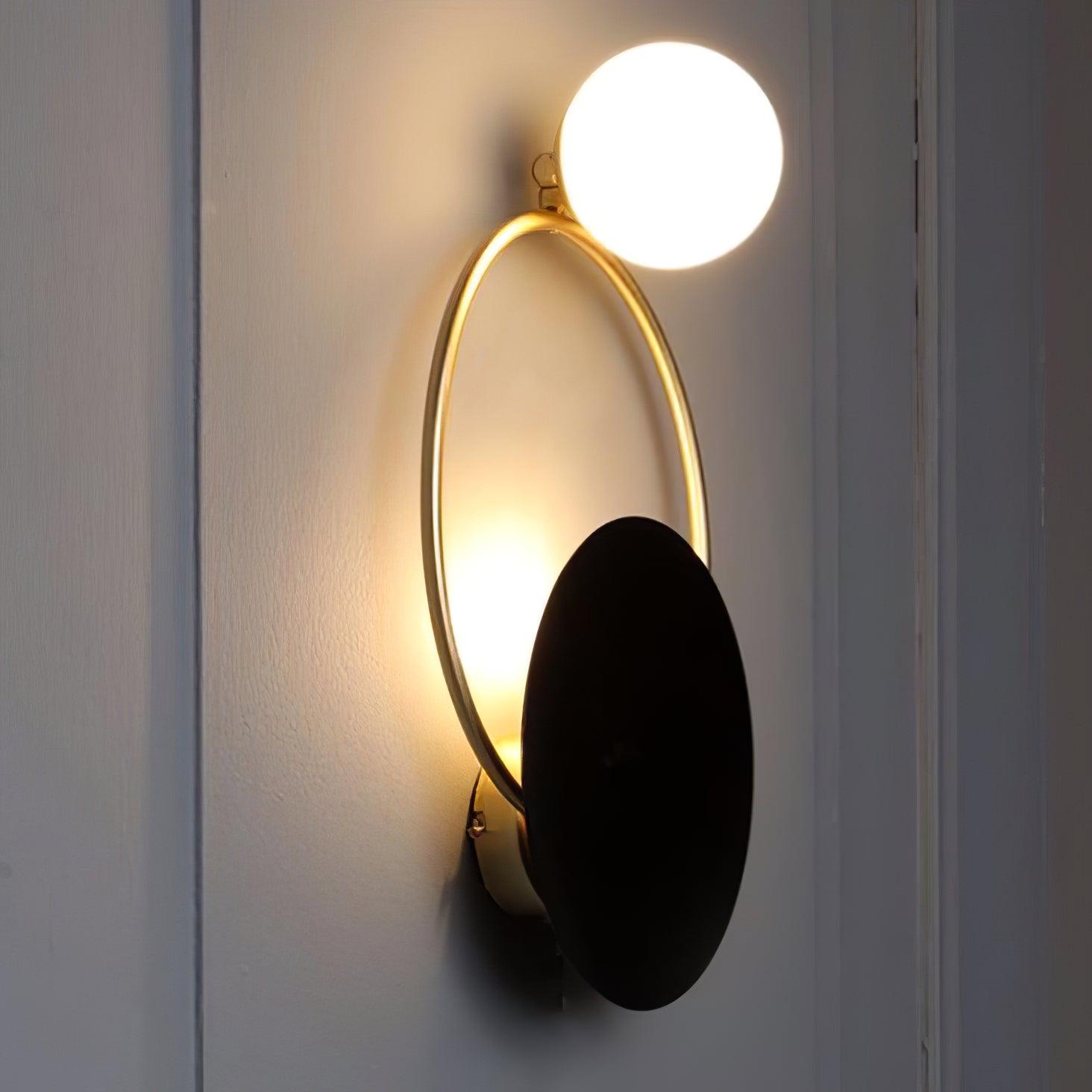 modern-geometric-black-and-gold-wall-sconce-with-white-glass-sphere-light-fixture