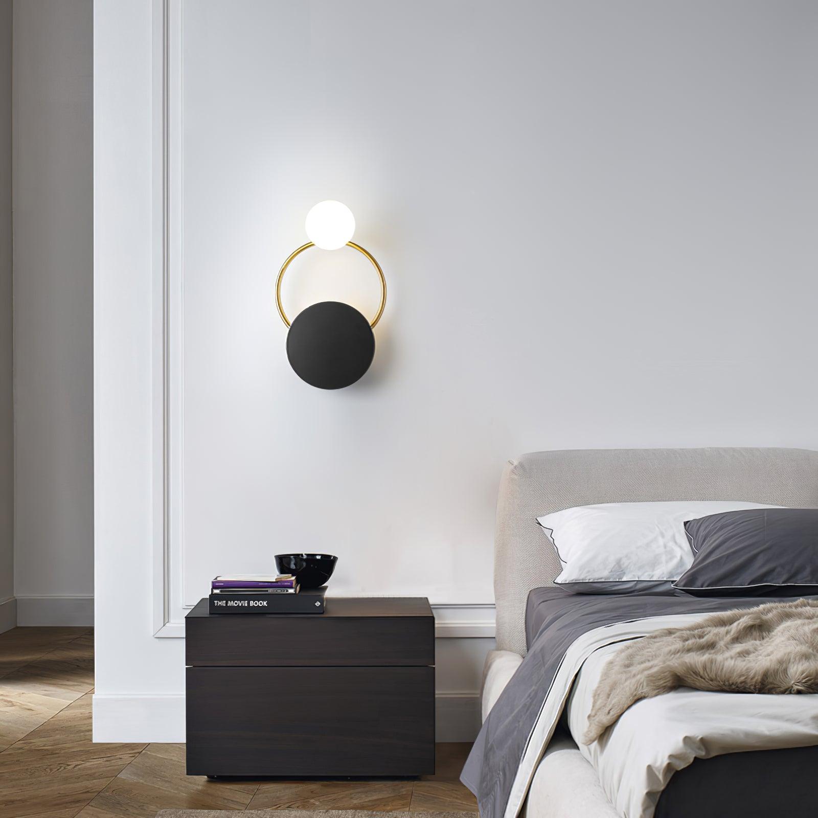 modern-geometric-black-and-gold-wall-sconce-with-white-glass-sphere-light-fixture