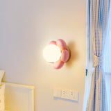 elegant-floral-wall-sconce-lighting-with-glass-shade-and-natural-wood-base