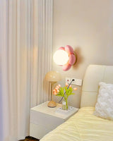 elegant-floral-wall-sconce-lighting-with-glass-shade-and-natural-wood-base